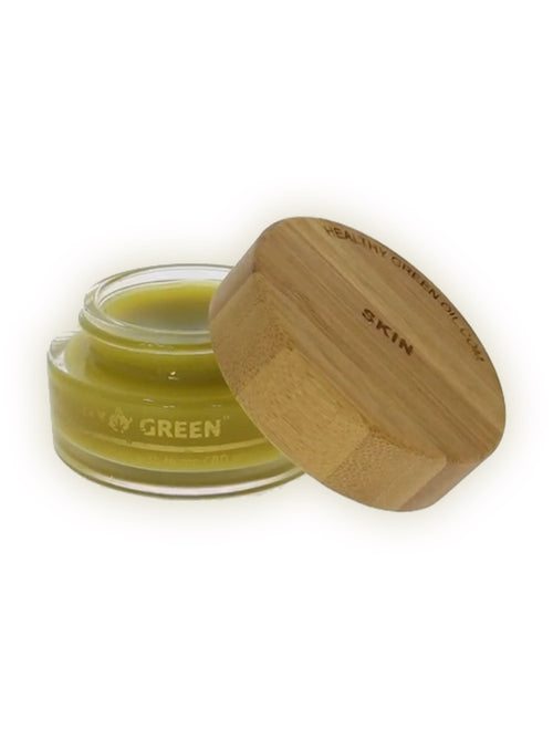 Healthy Green Botanical Balm — Skin in a clear glass jar with an engraved bamboo lid